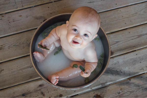 baby in a breast milk bath
